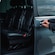 A private driver opening the door of a luxury minivan